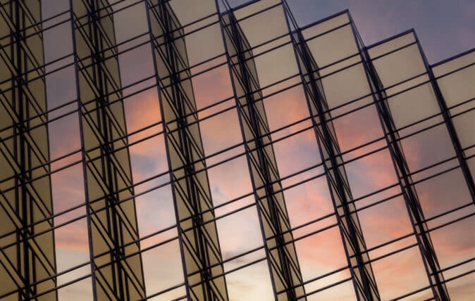 Skyscraper reflecting the sky at night