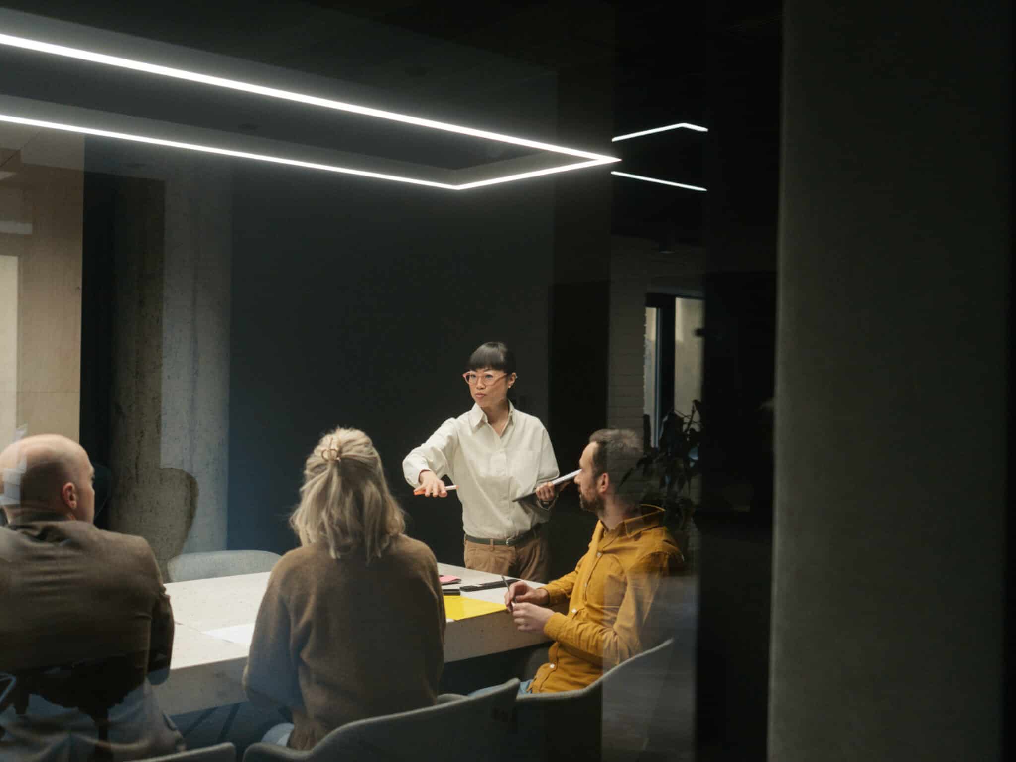 Group meeting in a dimly lit conference room